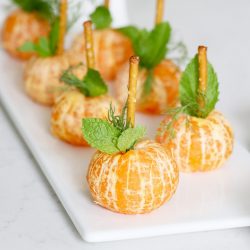 orange cuties on plate to look like pumpkins.